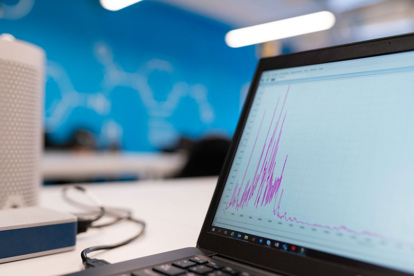 Laptop displaying a data analytics growth graph